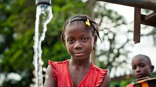 Girl in red dress looking at camera